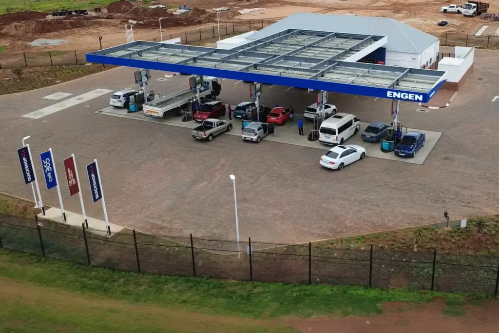 retail fuel station Kempton Park completed Engen Evergreens forecourt with canopy, pumps, vehicles and Quickshop building
