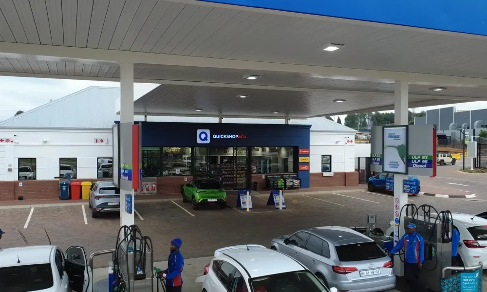 retail fuel station Kempton Park fuel canopy and Quickshop frontage with vehicles and pump islands