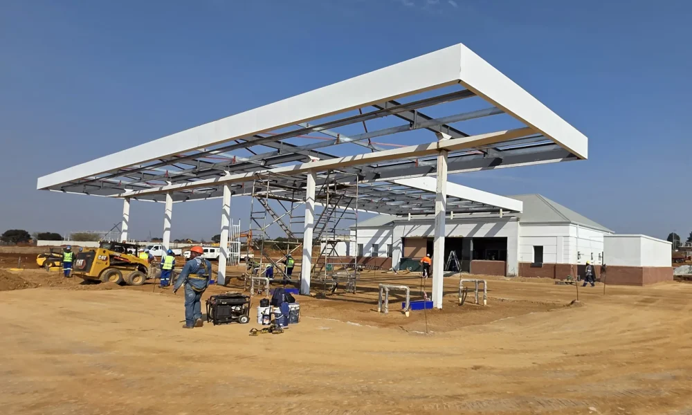 retail fuel station Kempton Park canopy structure construction with service station building behind