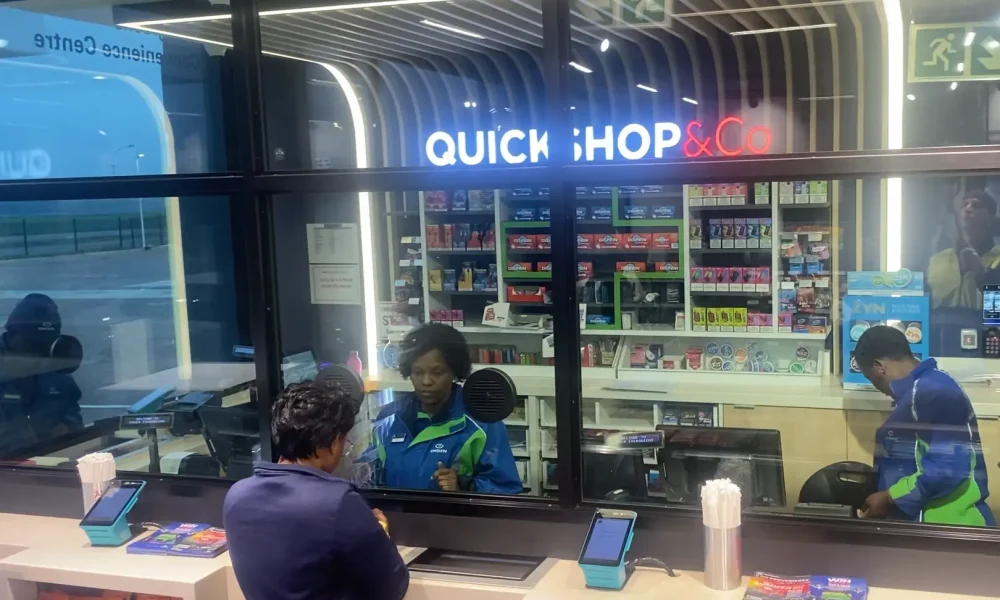retail fuel station Kempton Park Quickshop checkout counter with staff and retail display area