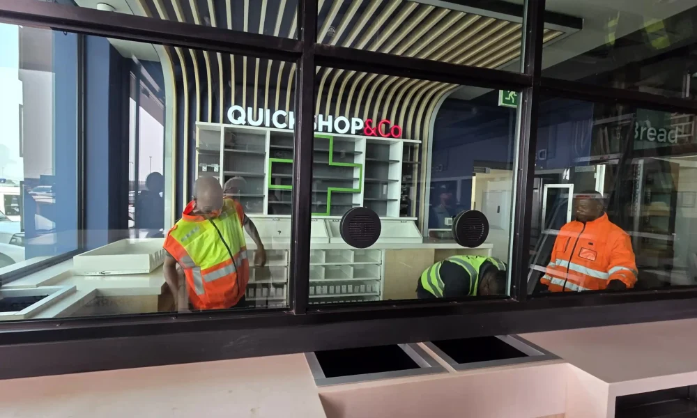 retail fuel station Kempton Park Quickshop front counter installation behind shopfront glazing